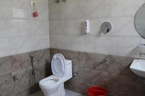 a bathroom with a toilet and a sink at K For Kasol in Kasol
