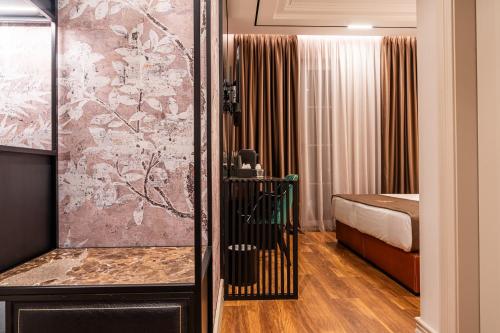 Letto o letti in una camera di Art Gallery Boutique Hotel