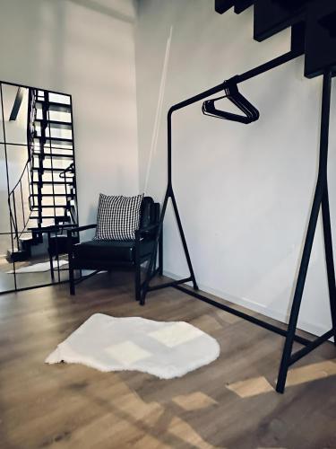 a room with a white board and a chair at Wohnen im Turm Genialer Schlossblick in Steinfurt