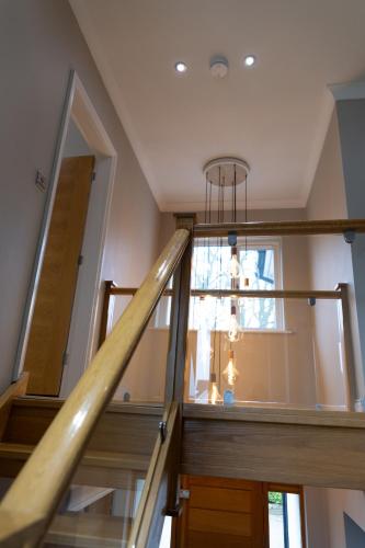 a staircase in a house with a window at The Luxury House in Swanland