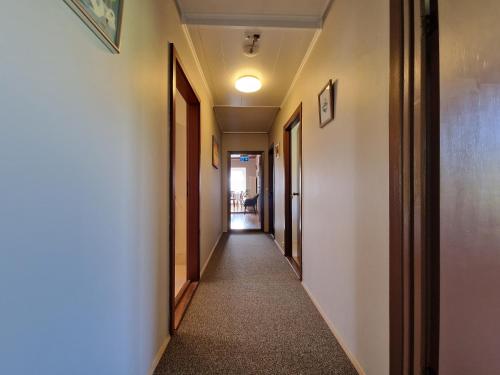 a corridor of a hallway with a hallway at Helgafell Guesthouse in Stykkishólmur