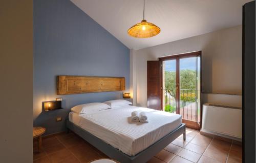 a bedroom with a bed with a teddy bear on it at Casa La Tana Della Lepre in Cingoli