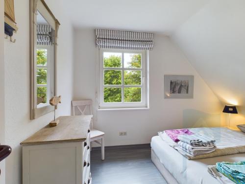 Katil atau katil-katil dalam bilik di Ferienwohnung Südstrandperle