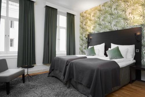 Postel nebo postele na pokoji v ubytování Home Hotel Plaza