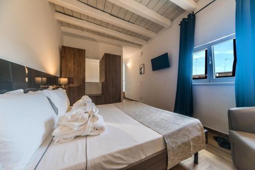 Ένα ή περισσότερα κρεβάτια σε δωμάτιο στο Suite Santa Chiara