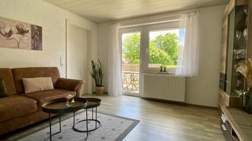 a living room with a couch and a table at Ferienwohnung Schmid in Lautrach