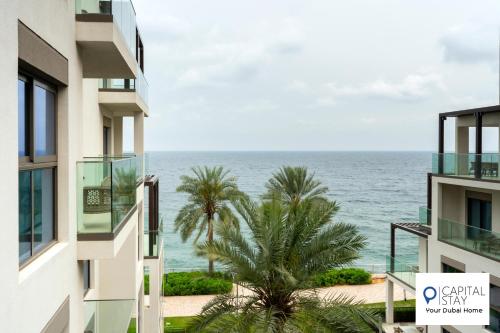 a view of the ocean from a building at Capital Stay- Private Two Bed Apartment - The Address Beach Resort Residences Fujairah in Fujairah
