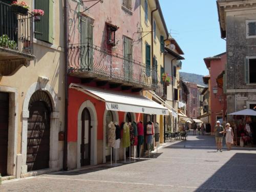a street in an old town with people walking at Apartment Adelaide by Interhome in Albisano