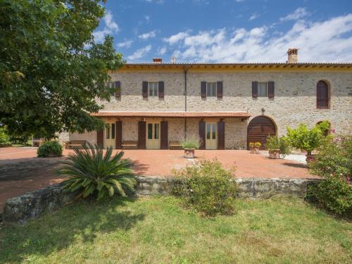 an old stone building with a large courtyard at Holiday Home Il Leccio by Interhome in Vitolini