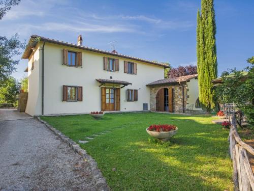 a large white house with a yard at Apartment Noemi by Interhome in Podere Panzano