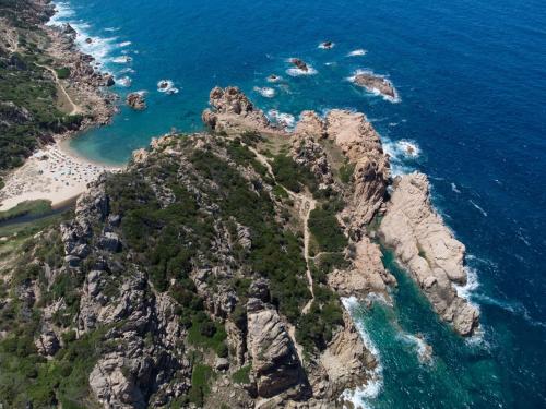 an aerial view of a rocky mountain with a beach at Holiday Home Mare-3 by Interhome in Li Valcaggi