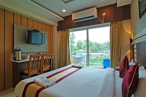 Postel nebo postele na pokoji v ubytování Sea Resort !! 500 Metre Dheusagar Park !! New Digha !! Pet Friendly !!
