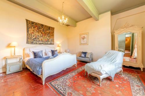 a bedroom with two beds and a mirror at Maison Augustine - 300m2- Lisle-sur-Tarn in Lisle-sur-Tarn