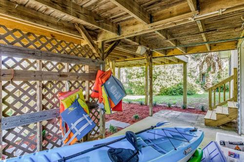 a room with a boat and bags hanging from the ceiling at Herron's Nest in Pensacola