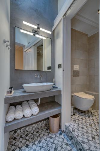 Ένα μπάνιο στο Vittore Gambello Rooms