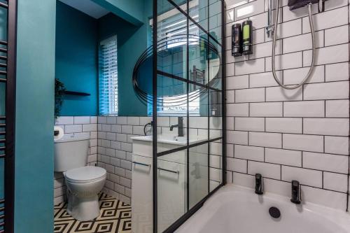 a bathroom with a tub and a toilet and a sink at Newly refurb 3 bed with parking in Stockton-on-Tees