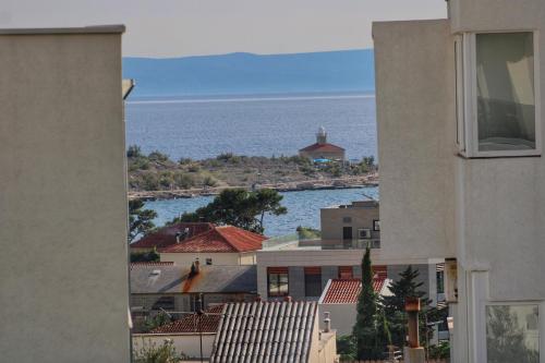 a view of the ocean from a building at Villa Melassy in Makarska