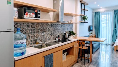 a kitchen with a sink and a counter at Hanoi Home 2 - Lake View Apartment in Hanoi
