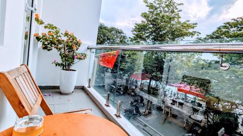 a balcony with a table and a view of a patio at Hanoi Home 2 - Lake View Apartment in Hanoi