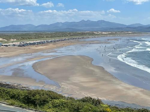 an aerial view of a beach with people on it at Shamrock Cottage in Inch