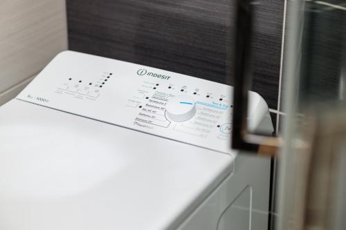 a box is sitting on top of a microwave at Baltic Apartments in Pobierowo