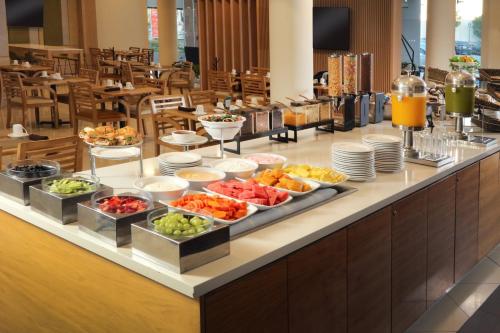 a buffet line with different types of food on it at Holiday Inn Tijuana Zona Rio, an IHG Hotel in Tijuana