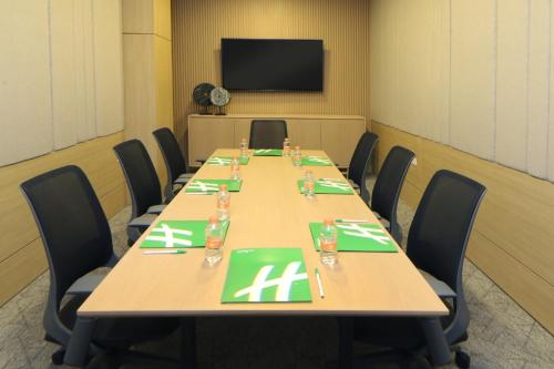 a conference room with a long table with chairs at Holiday Inn Tijuana Zona Rio by IHG in Tijuana