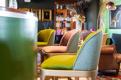 a row of chairs in a waiting room at Park Hotel Pineta Boutique Hotel in Caorle