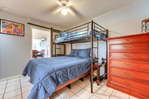 a bedroom with a bunk bed and a dresser at Waterfront Lake Buchanan Cottage with Kayaks! in Burnet