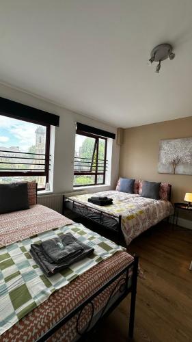 Ένα ή περισσότερα κρεβάτια σε δωμάτιο στο Portobello Guest Rooms