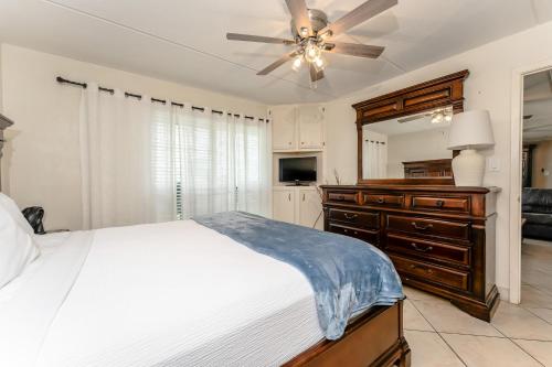 a bedroom with a bed and a ceiling fan at 1204 Saida I - Beach Front in South Padre Island