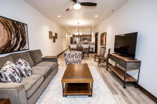 a living room with a couch and a piano at Columbia Crest 301 in Columbia Falls