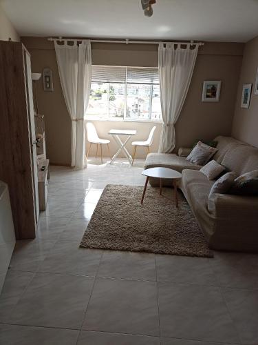 Гостиная зона в Piso FOFI, junto a la playa