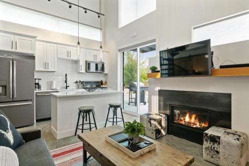 an open kitchen and living room with a fireplace at Quarry A7 in Whitefish
