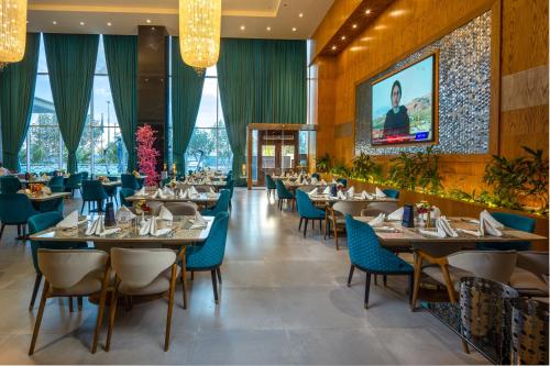 Reštaurácia alebo iné gastronomické zariadenie v ubytovaní Donatello Jeddah Hotel