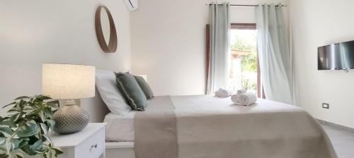 Ένα ή περισσότερα κρεβάτια σε δωμάτιο στο Casa Laurina