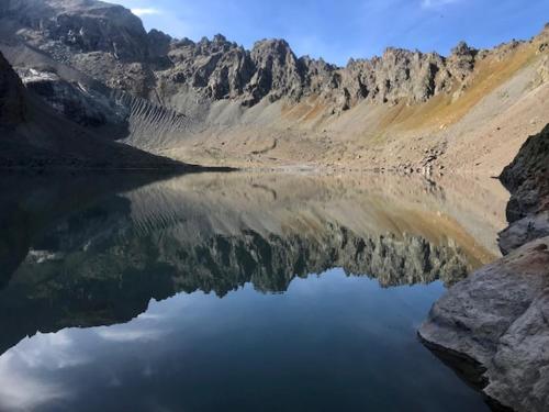 a reflection of a mountain in a body of water at Les granges d'Arvieux vue sur le Queyras in Arvieux
