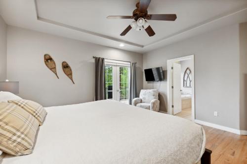 a bedroom with a bed and a ceiling fan at Suncrest Hideaway in Whitefish