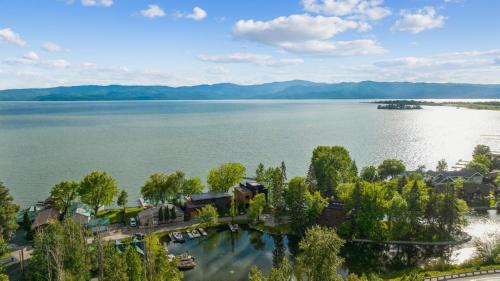 an aerial view of a house on the shore of a lake at Swan Lake House in Bigfork