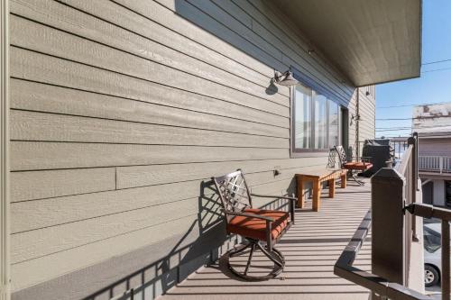 a porch with chairs and tables on a house at Baker Loft 201 in Whitefish