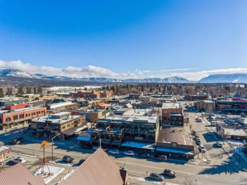 an aerial view of a city with mountains in the background at Baker Loft 201 in Whitefish