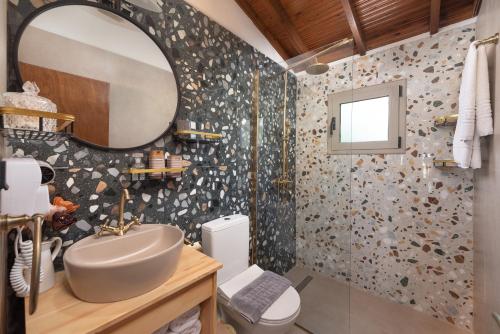 Ett badrum på Ilaira Sea View Bungalow