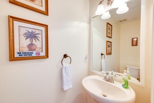 a bathroom with a sink and a mirror at Atlanta-Area Home with Yard about 2 Mi to Six Flags in Austell