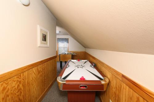 a room with a ping ping pong table in it at Cedar Falls by Eden Crest in Pigeon Forge