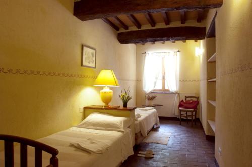 Ένα ή περισσότερα κρεβάτια σε δωμάτιο στο Agriturismo Sant'illuminato