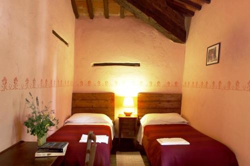 Ένα ή περισσότερα κρεβάτια σε δωμάτιο στο Agriturismo Sant'illuminato