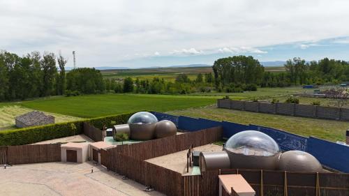 a group of silver domes sitting on top of a building at COSMOVEROS - Hotel Burbuja in Pedraza-Segovia