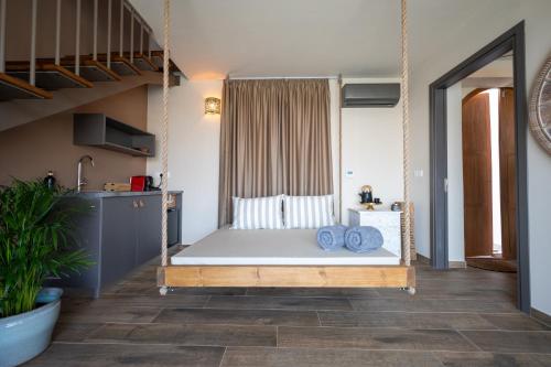 a room with a swing bed in a room at Exotic Sea Boutique Adults Only in Protaras