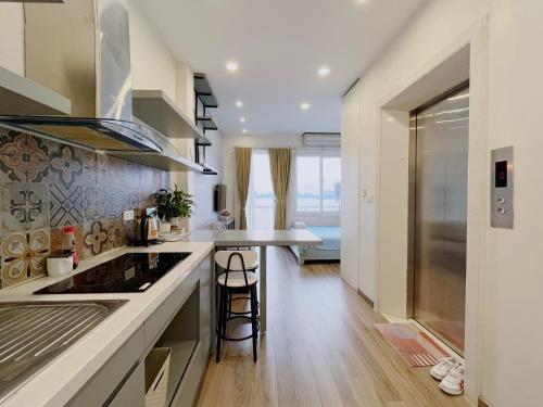 a kitchen with a sink and a counter top at Hanoi Home 2 - Lake View Apartment in Hanoi