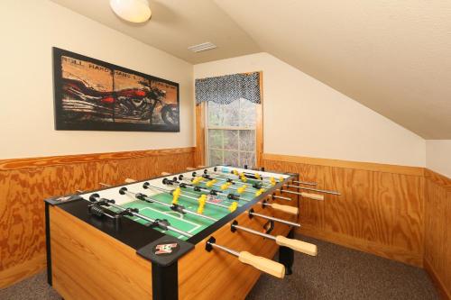 a game room with a foos ball on a table at Cedar Falls by Eden Crest in Pigeon Forge